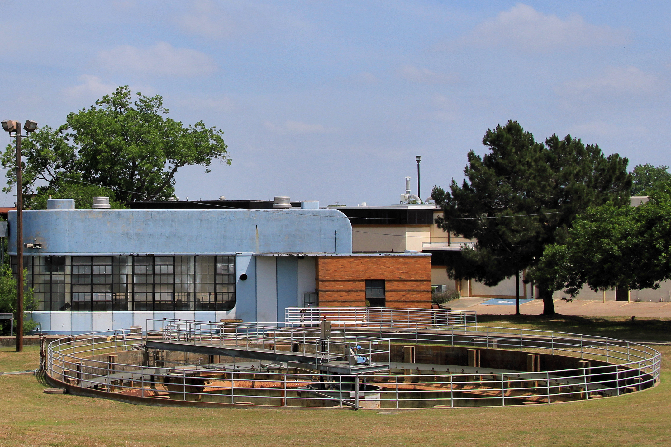 Treatment tank and support building at the former Govalle wastewater treatment plant in Austin, Texas.